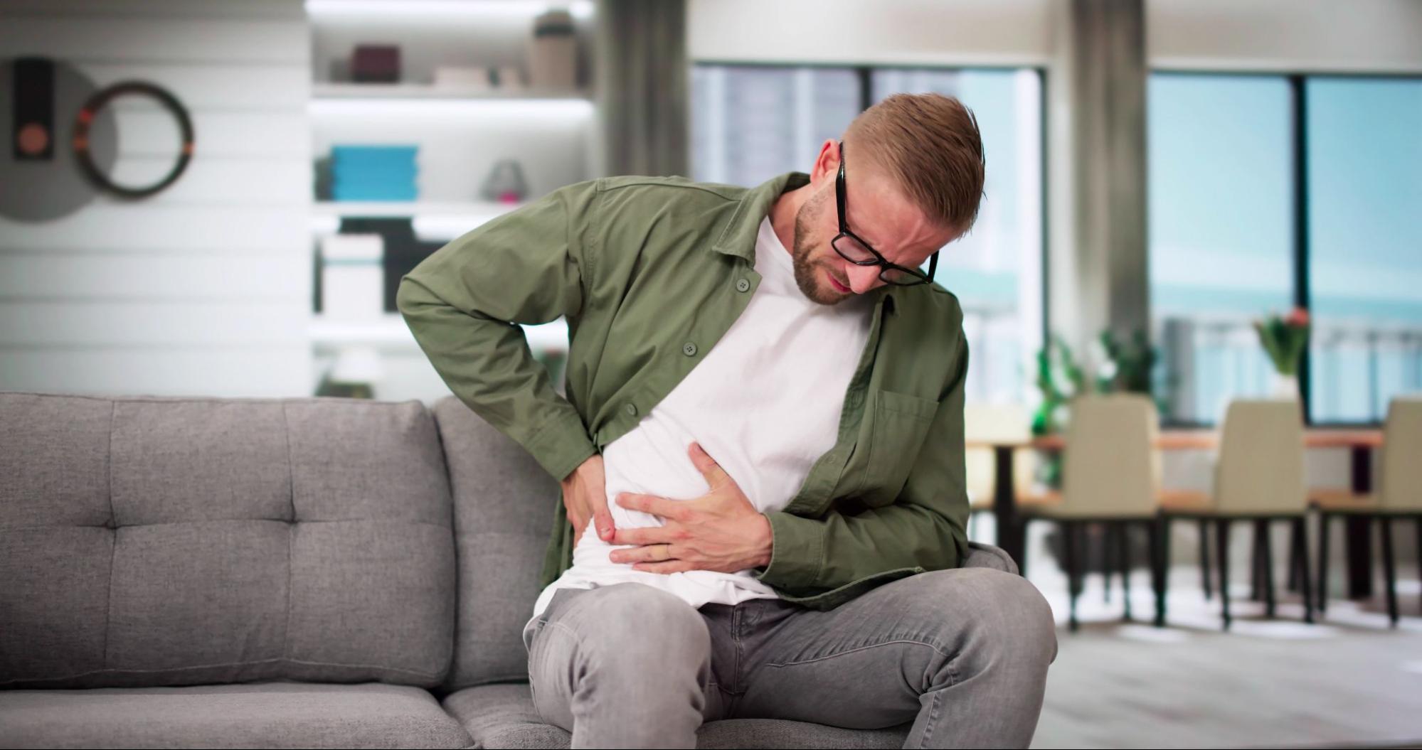 Man experiencing abdominal pain linked to fatty liver disease